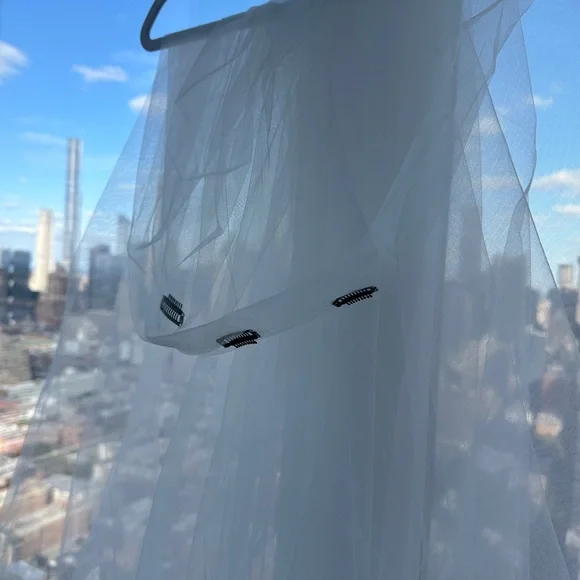 Brand new, pure white, whimsical veil